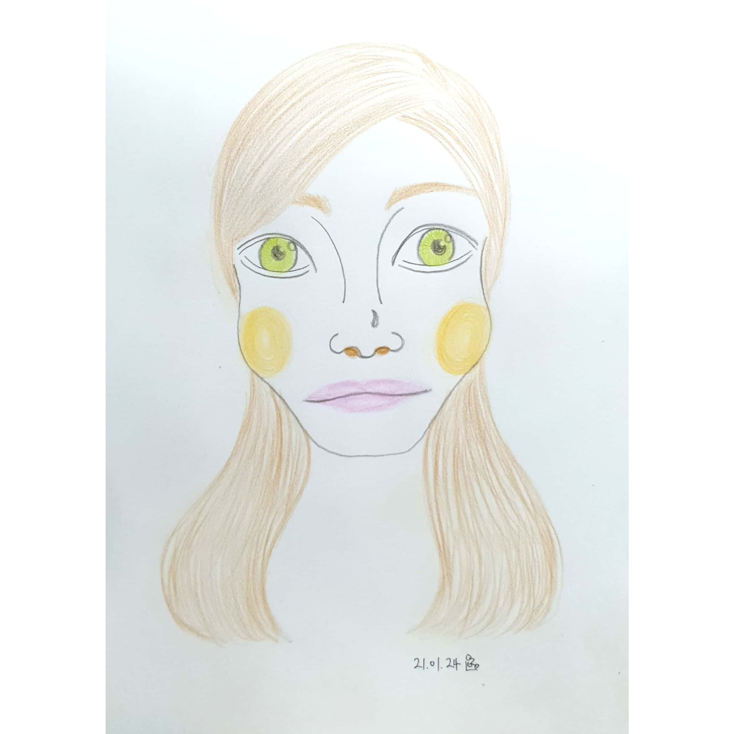  초록색 눈동자를 가진 여성의 얼굴