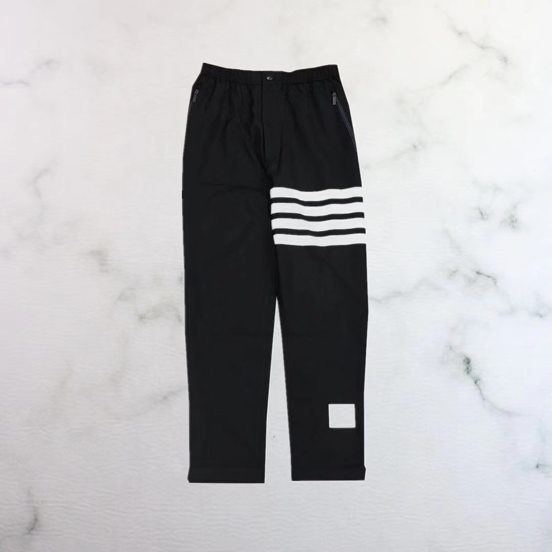  [THOM BROWNE] 톰브라운 네이비 플레인 위브 수트 스냅 프런트 트랙 팬츠 MTT012A06146415