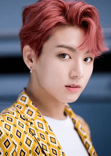 BTS member Jungkook's red hair color and yellow jacket