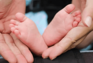 a photograph symbolizing life insurance a baby&#39;s foot