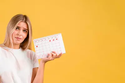 woman-being-upset-holding-period-calendar