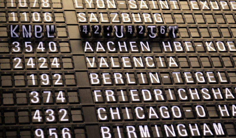 Airport Flight Information Board – Representing Global Travel and U.S. Reentry Planning After Visa Expiration