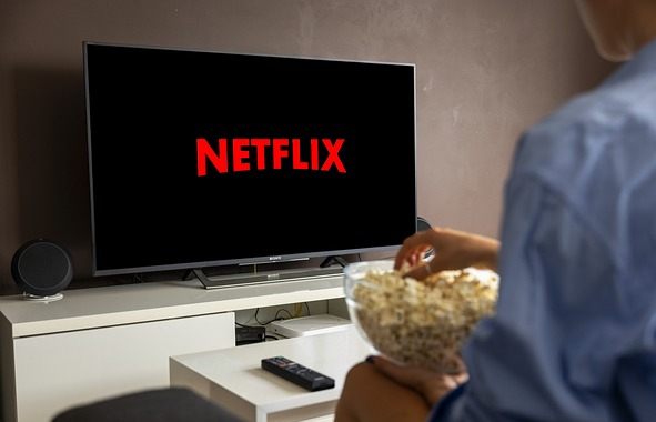 Eating popcorn while watching Netflix on TV