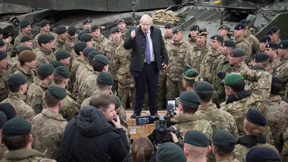 Boris Johnson in pre-Christmas visit to UK troops in Estonia - BBC News