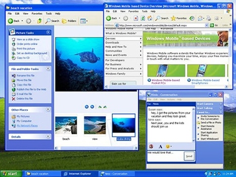 Windows XP 바탕화면과 여러가지 MSN메신저를 비롯한 프로그램이 실행된 모습