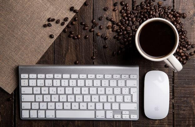 a picture of a keyboard and a cup of coffee