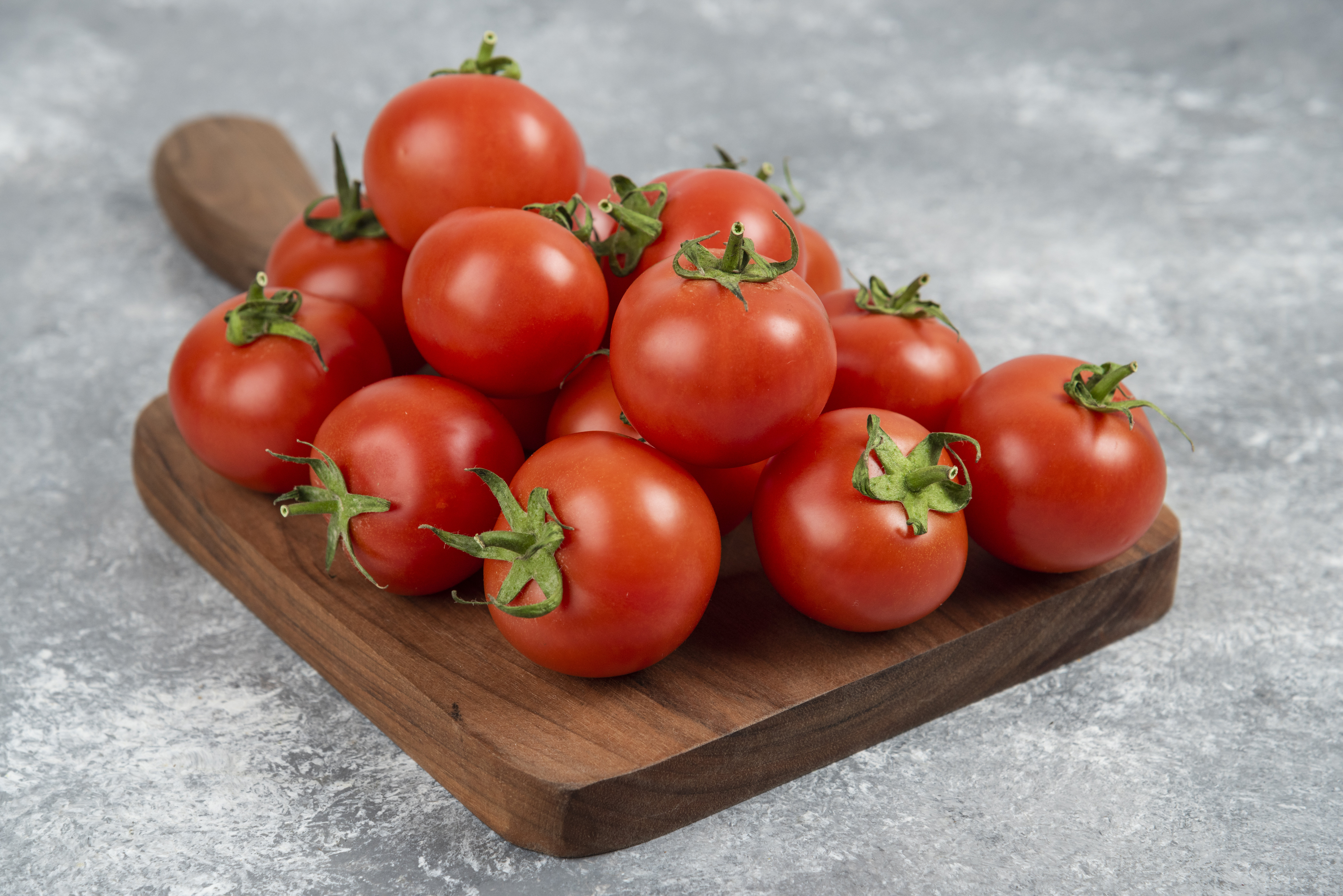 bunch-red-fresh-tomatoes-wooden-cutting-board
