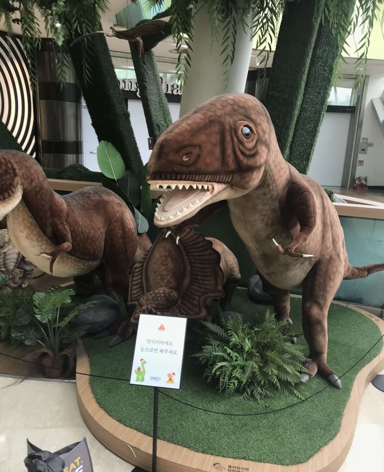 small scale dinosaur display in a shopping mall