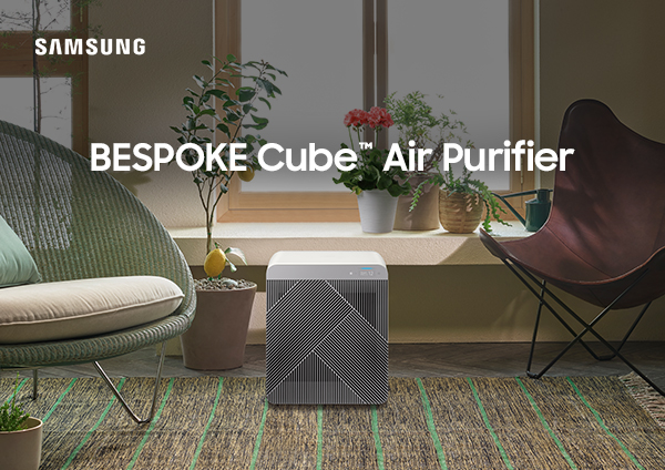 Samsung and LG air purifiers in a modern living room setting.