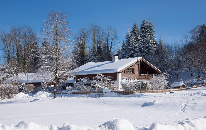 a house and trees covered with snow