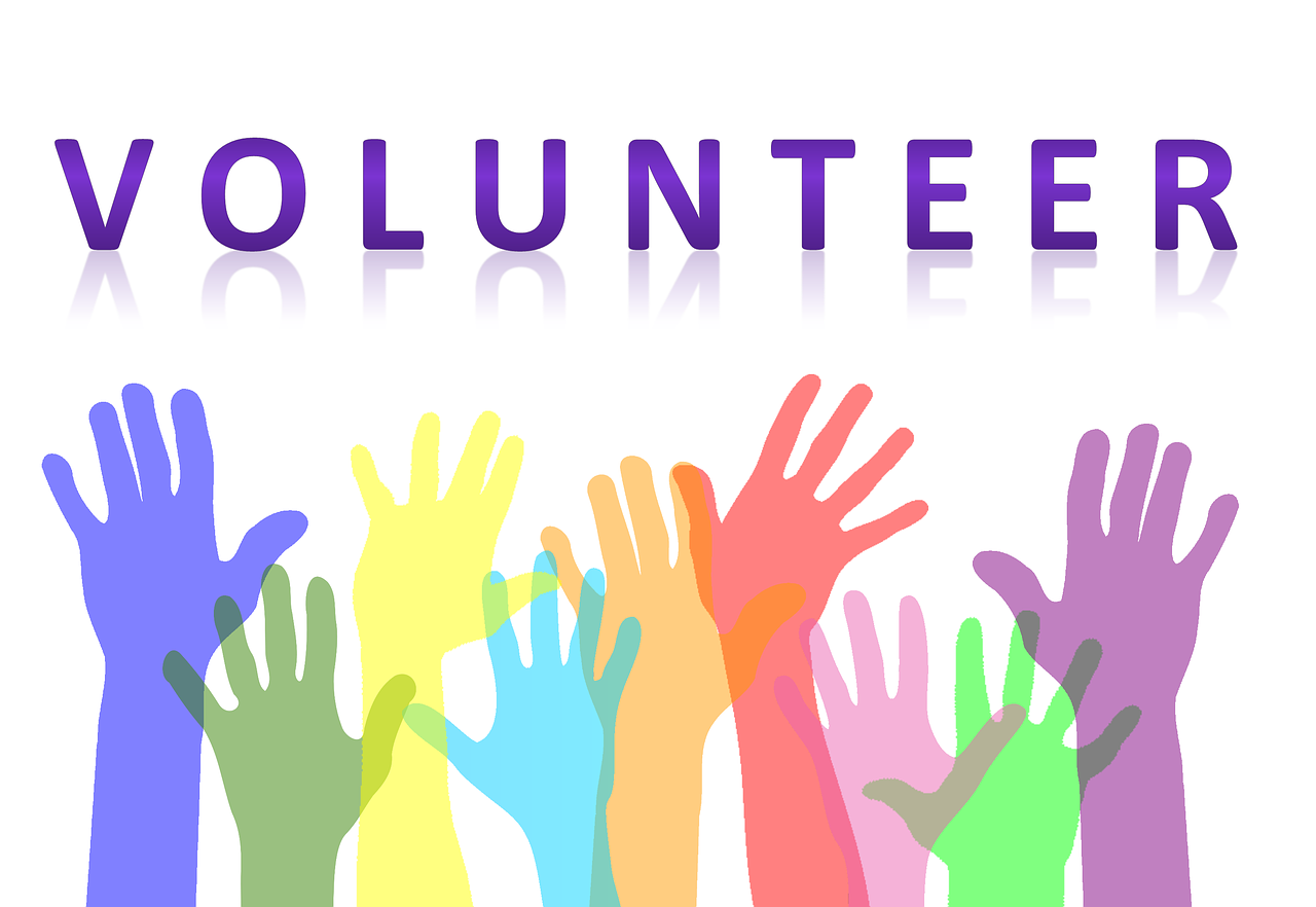 Colorful raised hands representing participation and volunteer spirit, suitable for 50s starting side income
