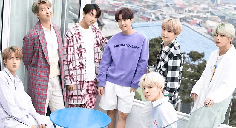 BTS members are wearing casual clothes in outside.