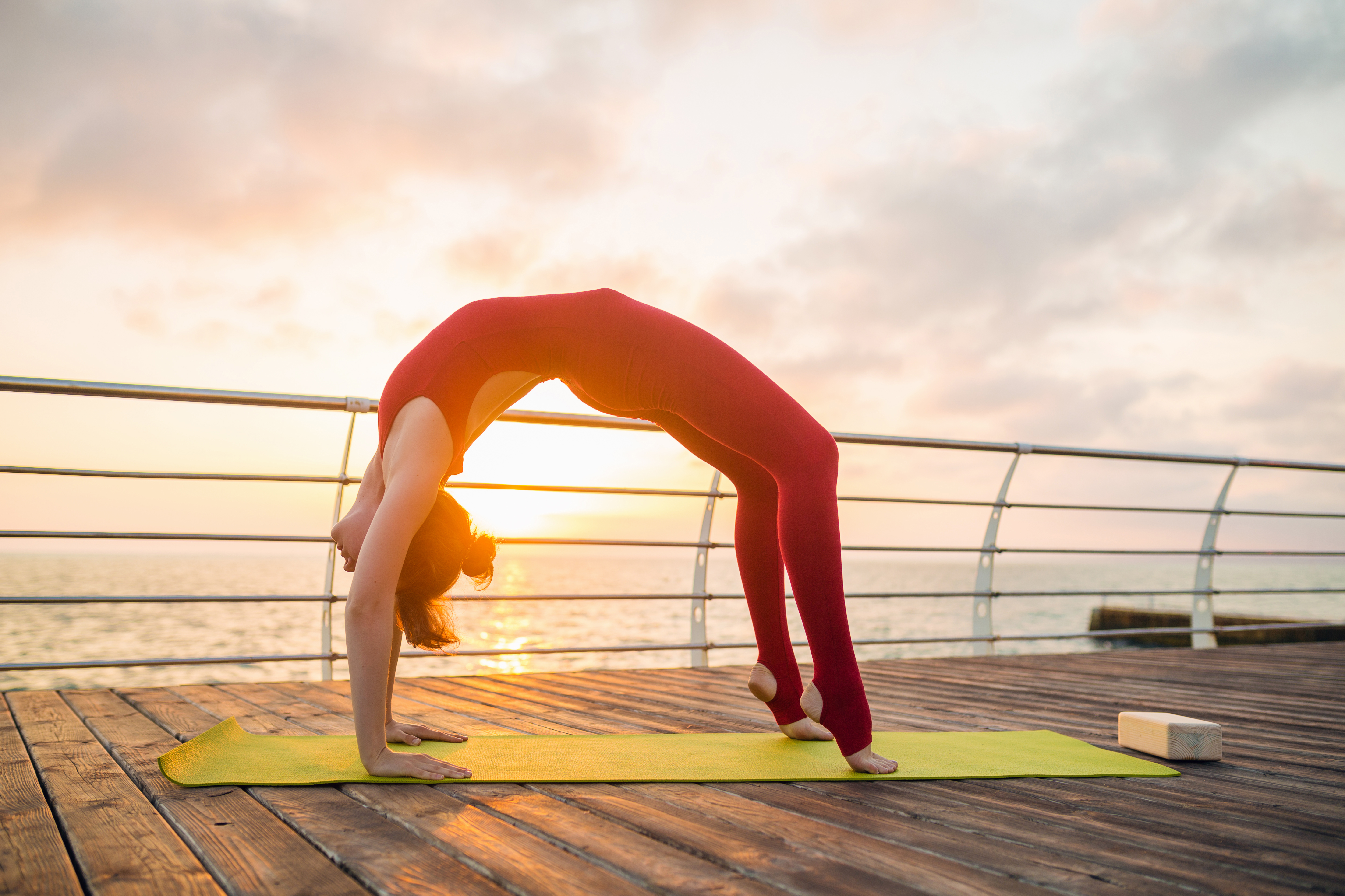 young-slim-beautiful-attractive-woman-doing-yoga-morning-sunrise-by-sea-healthy-lifestyle