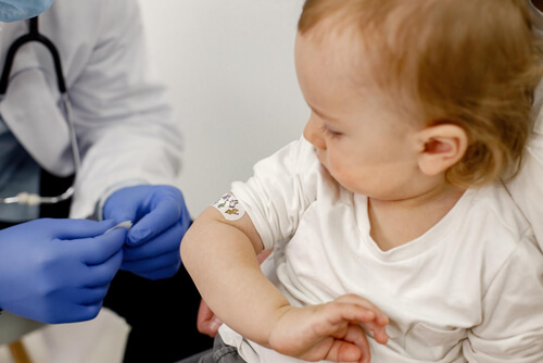 baby-shoulder-with-stick-bandaid-Rotavirus vaccine