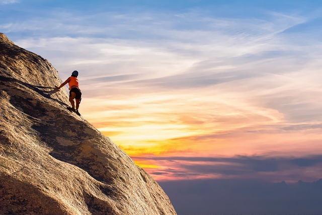 a person is climbing mountain