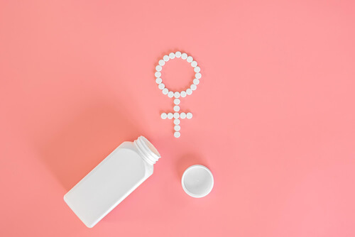 pills-pink-background-womens-health
