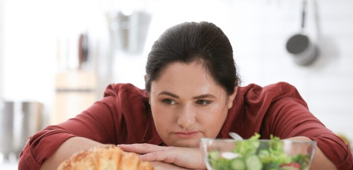 a woman who is worried about eating food emotionally