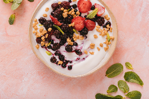 strawberry and blueberry in the smoothie bowl on the table