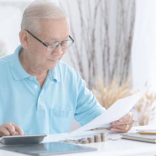 Elderly-man-checking-pension-documents