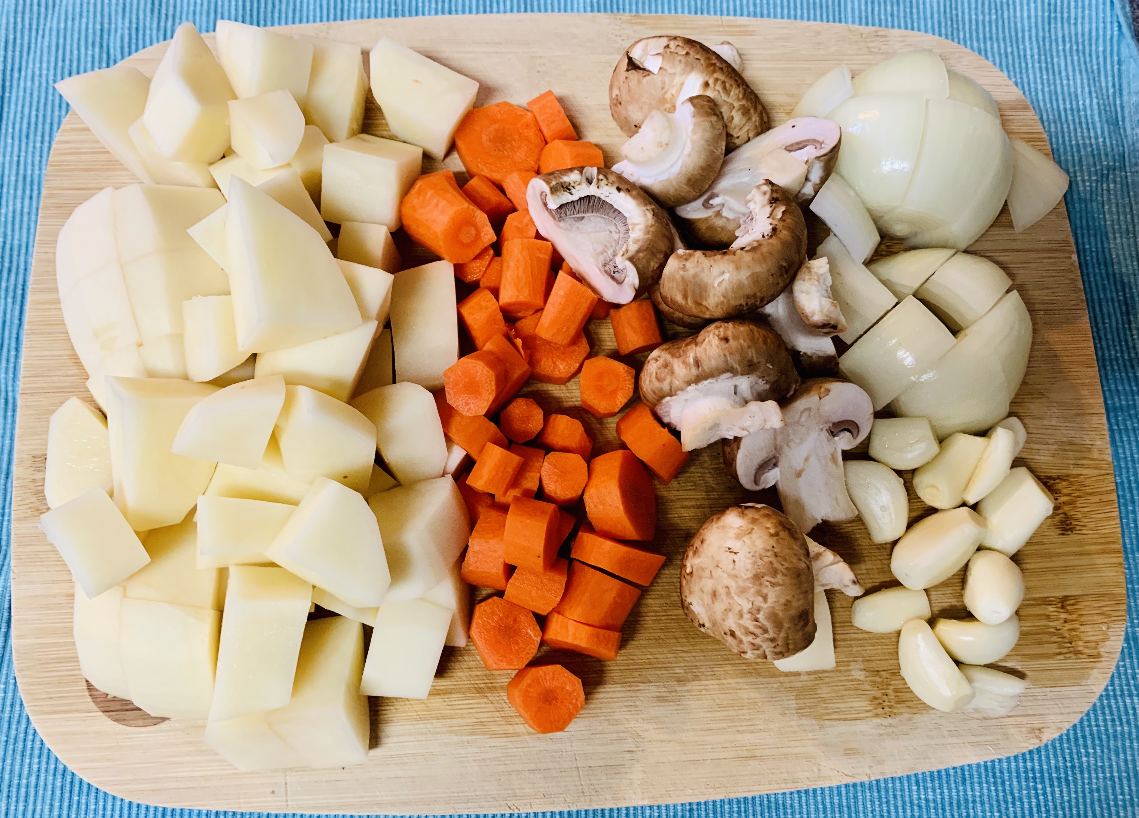 cutting borad-Potates-Carrots-Mushrroms-Onions-cutting-Scene
