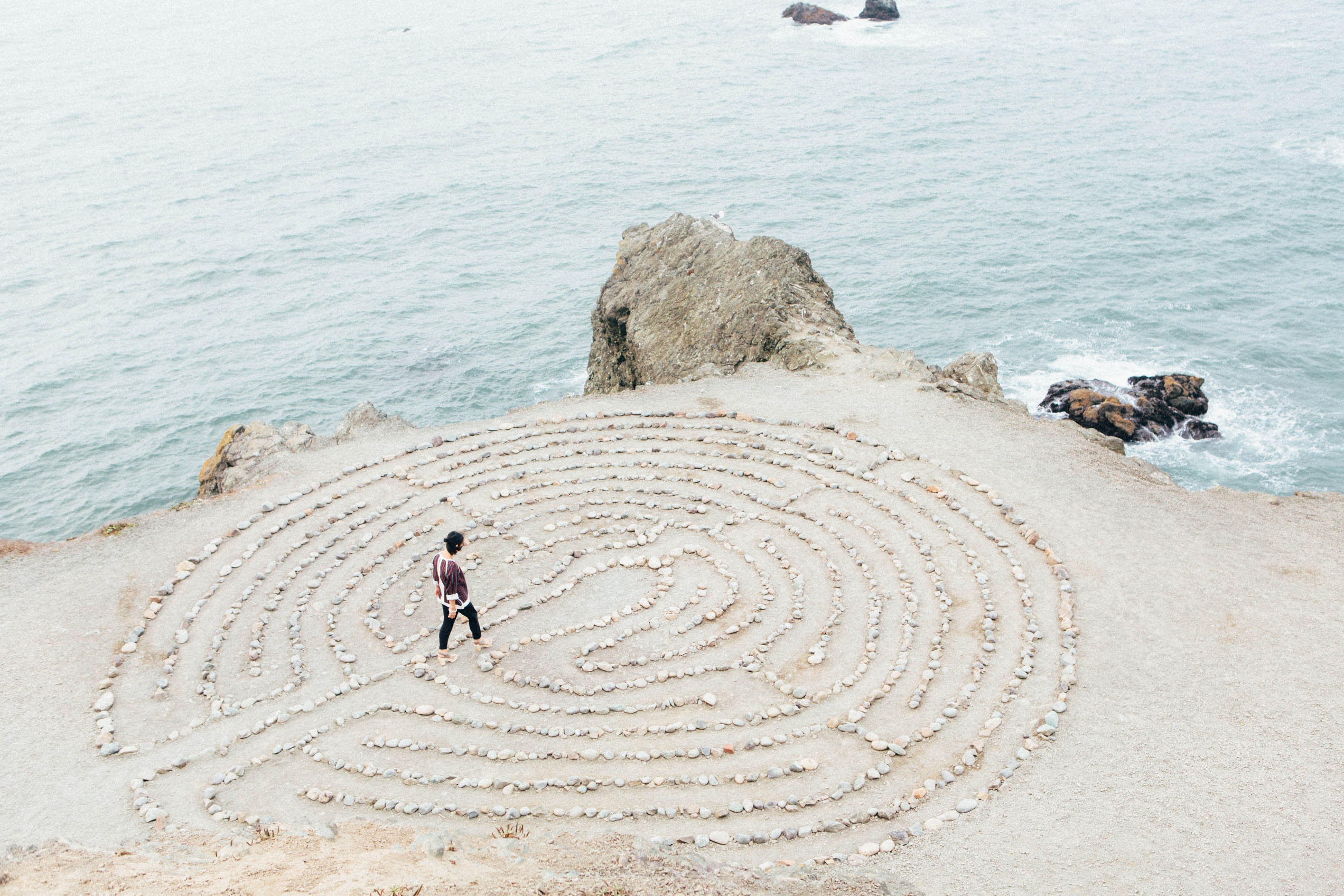 person walking on stone path