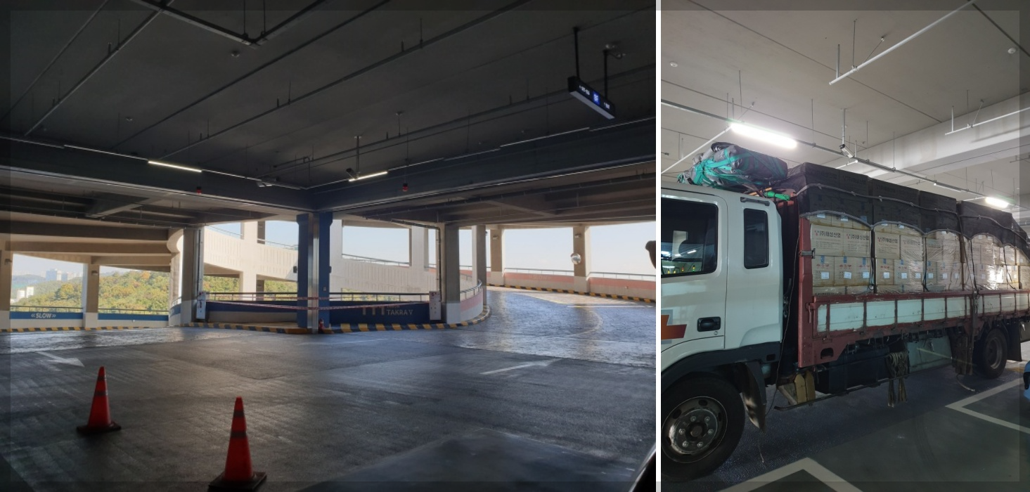 타원타크라5차 드라이브인 넓은 차폭과 층고 높이를 트럭과 비교하며 예시를 보여주는 사진