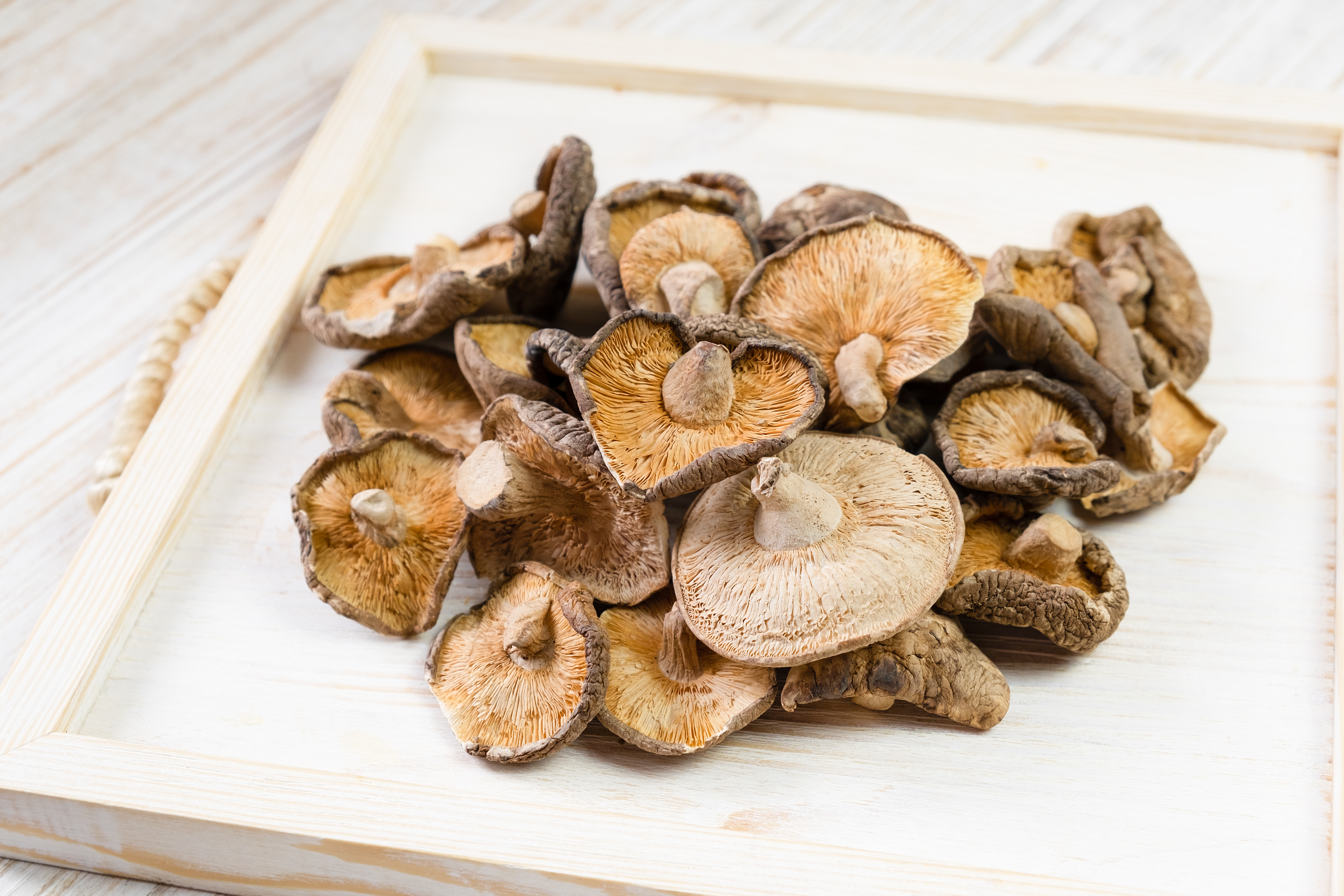 close-up-dried-shiitake-mushrooms-wooden-background