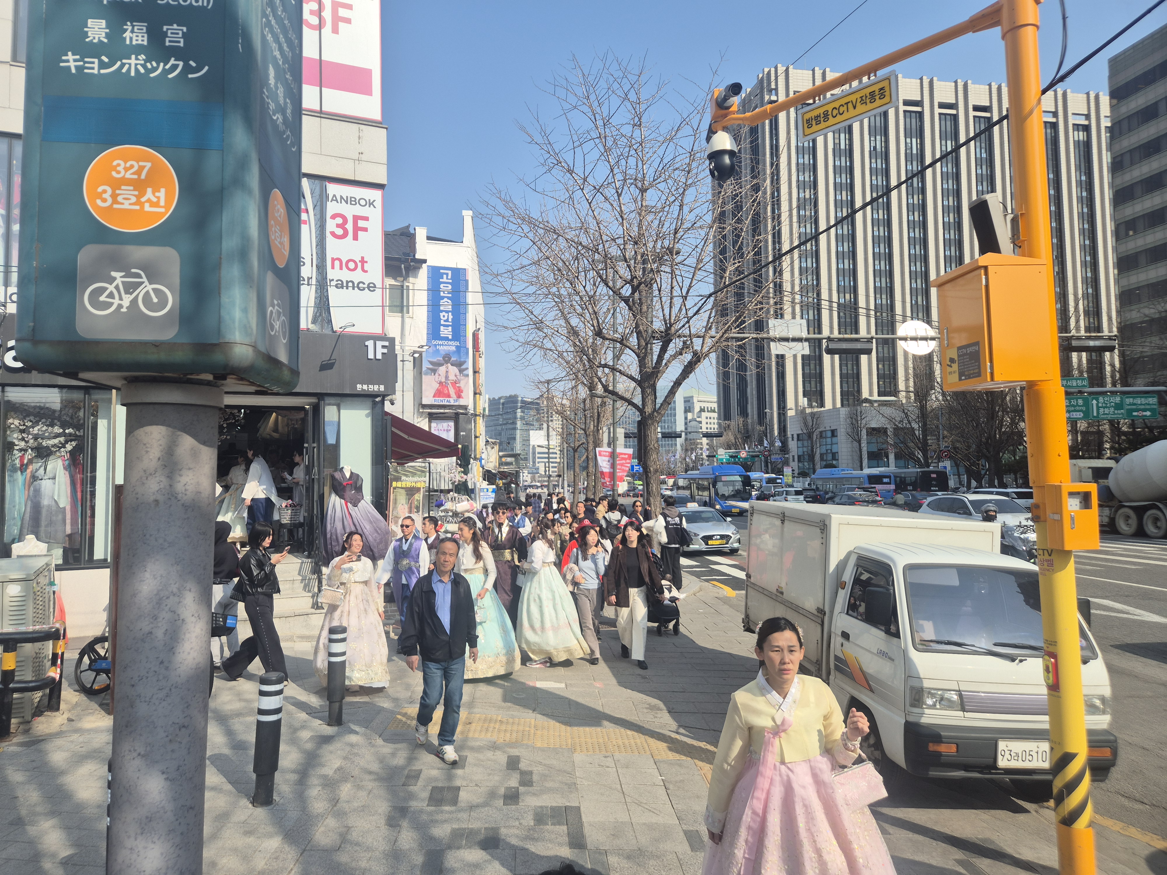 Tourists walking through crowded Seoul transportation areas