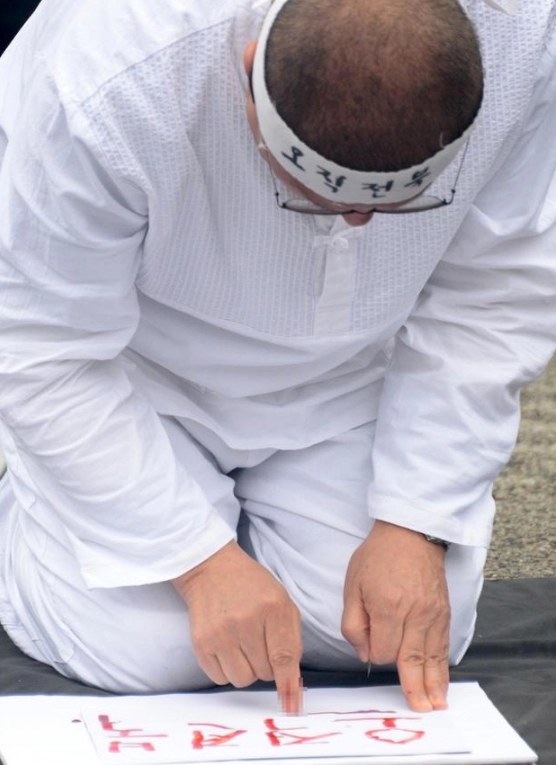 정운천 혈서 작성 이유