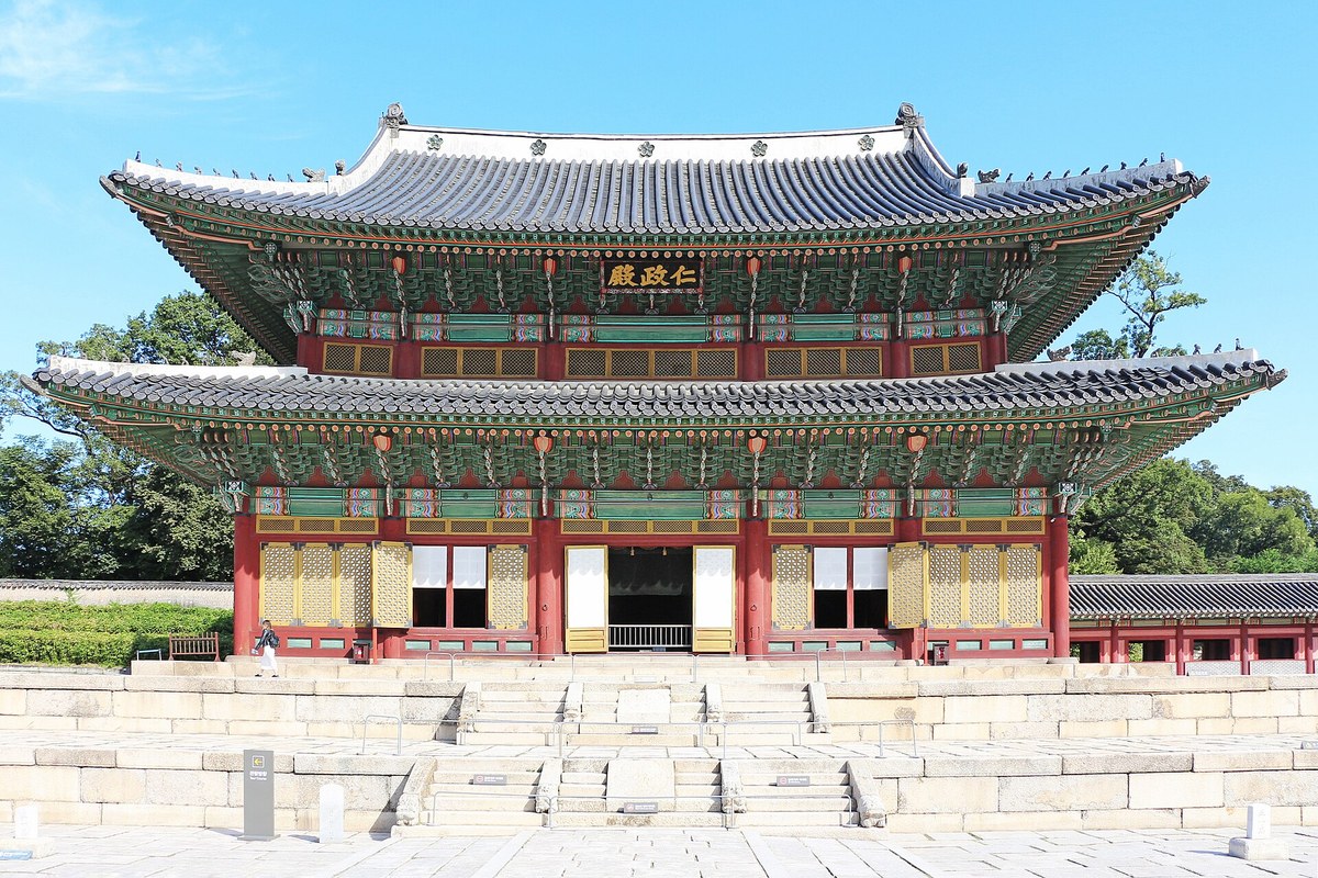 Injeongjeon Hall, the main throne hall of Changdeokgung Palace in Seoul, seen from the front under a blue sky
