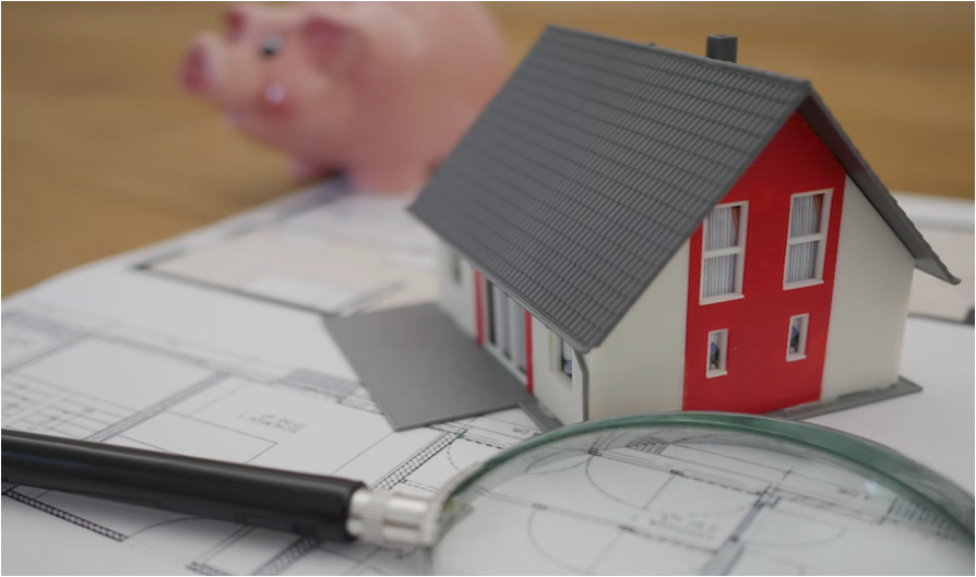 설계도-위에-있는-돋보기와-종으로-만든집