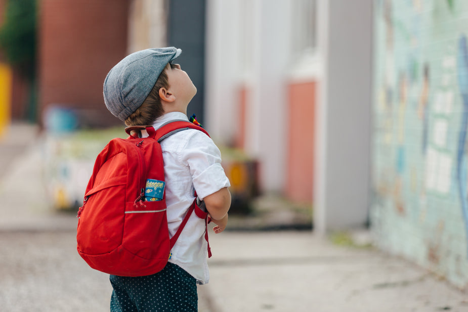 pre-schooler boy looking up
