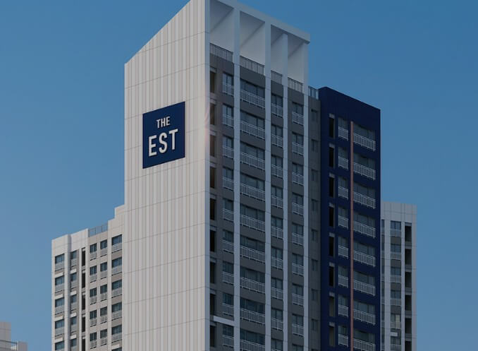 동문건설-홈페이지에-있는-디이스트-문구가-있는-아파트-사진입니다.