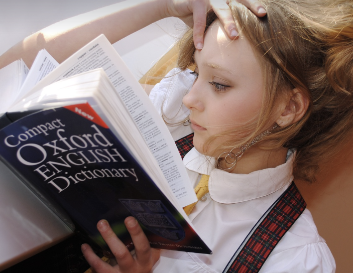 a girl reading English dictionary