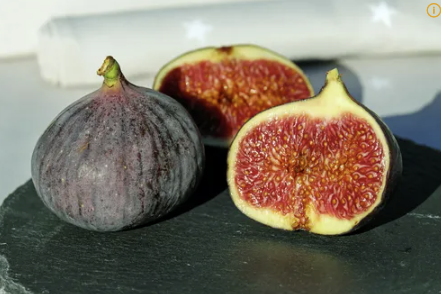 Fresh organic figs showing nutritional benefits and health effects for digestive improvement and blood pressure control