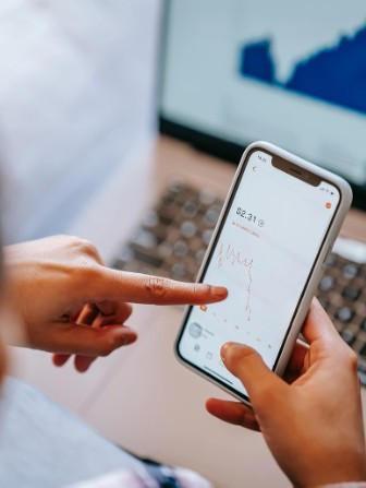 hands touching the phone for mobile banking app