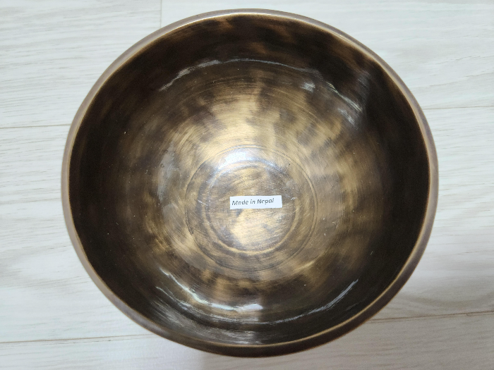 Copper alloy bowl with a made in Nepal sticker