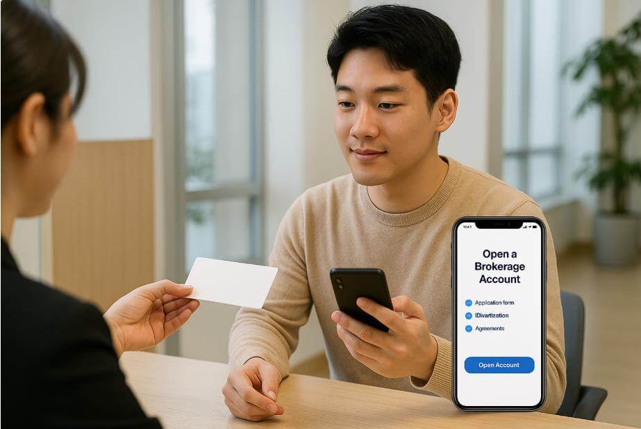 청년이 은행 창구에서 계좌 개설 상담을 받는 모습.