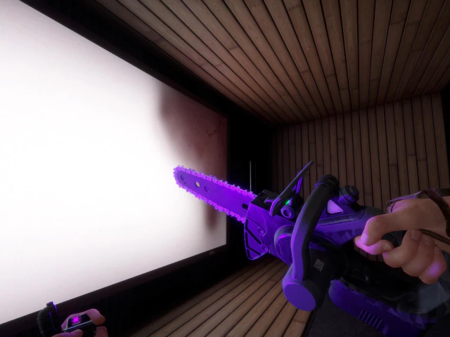 전기톱을 들어본 모습.