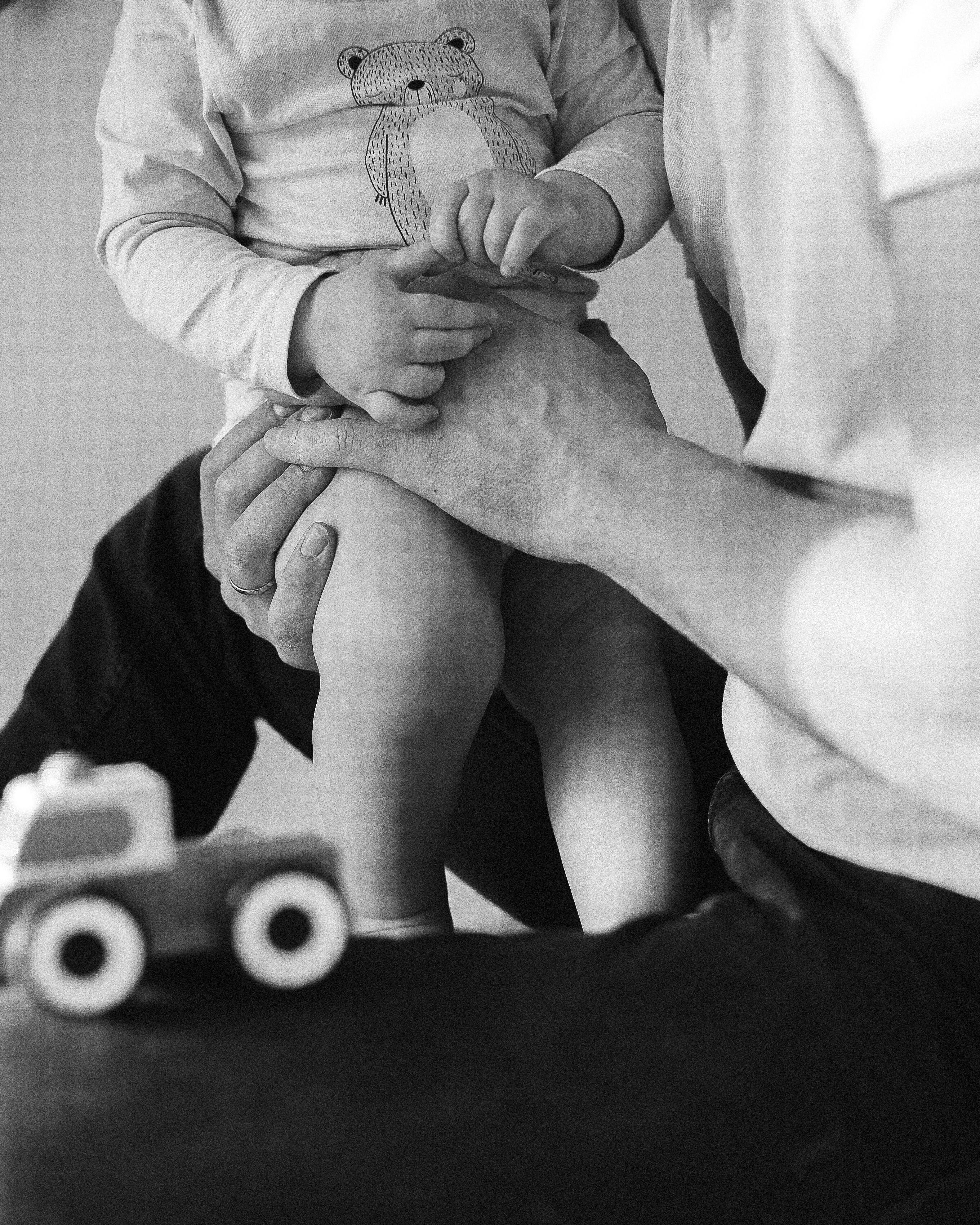 father holding a toddler