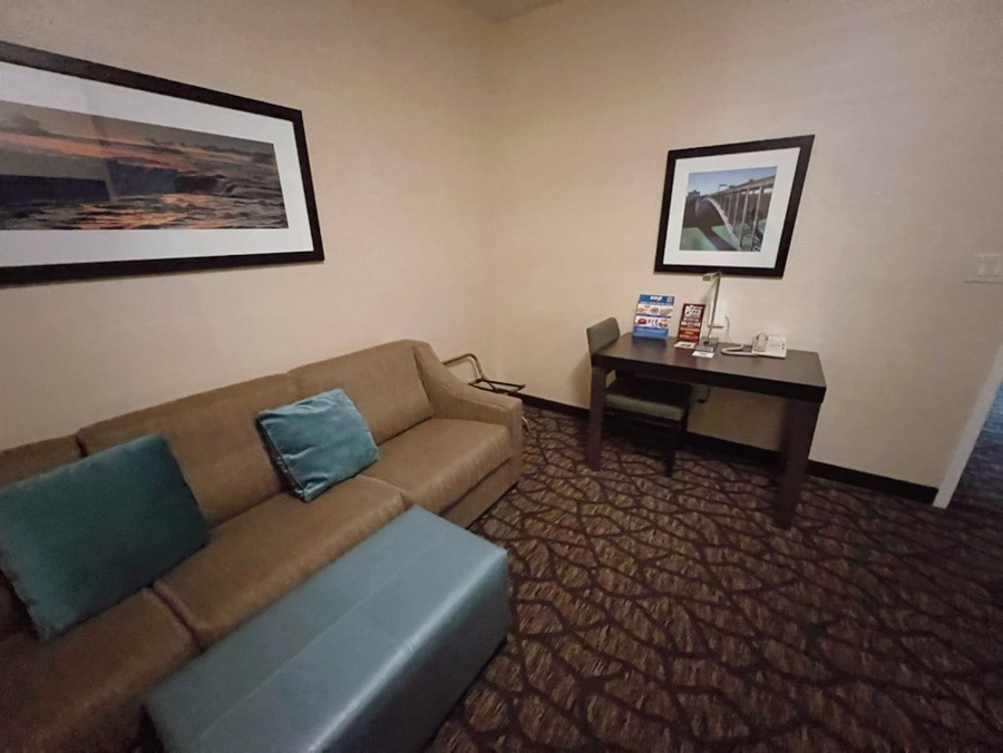 Separate living area with sofa bed in Embassy Suites Niagara Falls suite