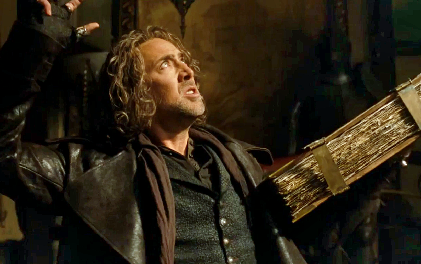 마법사의 제자 발타자르가 마법서를 들고 있는 장면