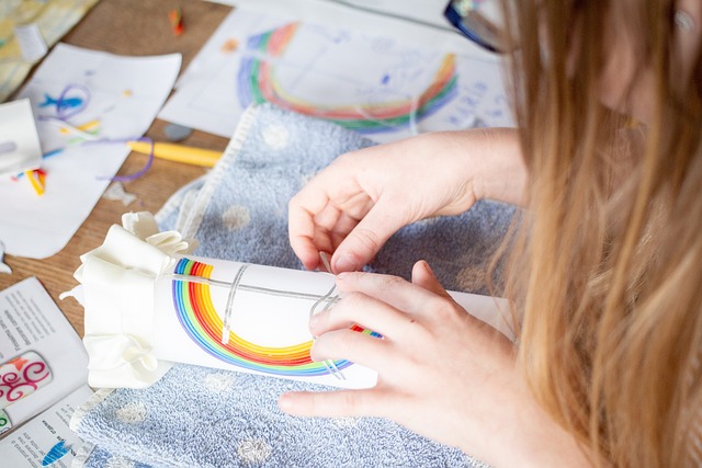 a girl is making some handcrafts