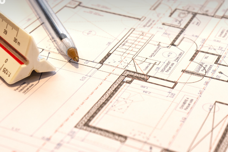 blueprint with pen and measuring rod