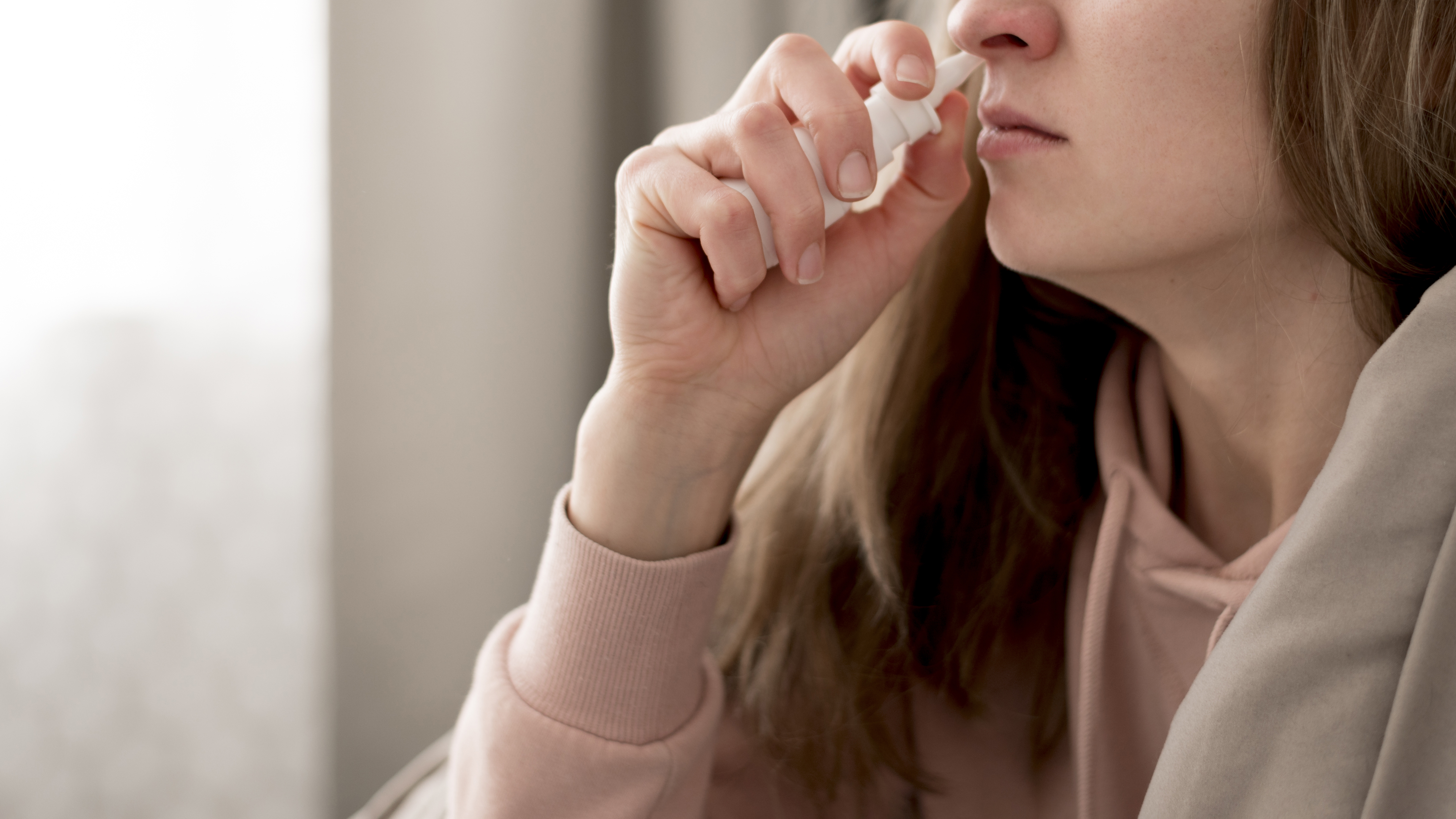 close-up-woman-taking-treatment-runny-nose.jpg