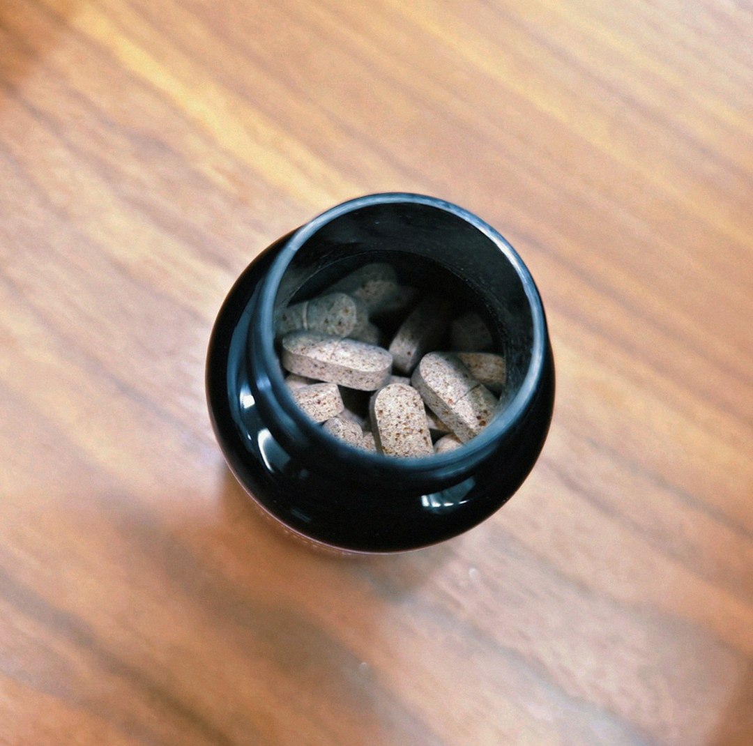 enervia 2.0 bottle on desk with morning light
