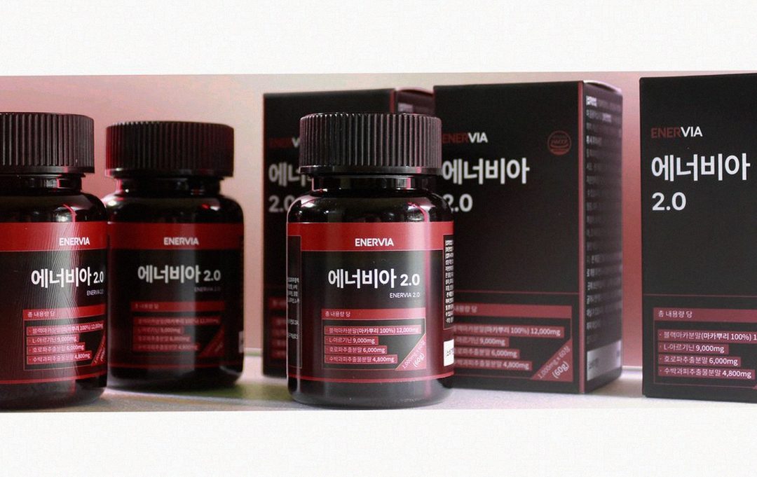 Korean Asian man in 40s taking supplement with water morning