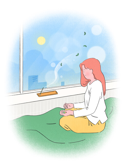 향기를 맡으며 명상하는 여성