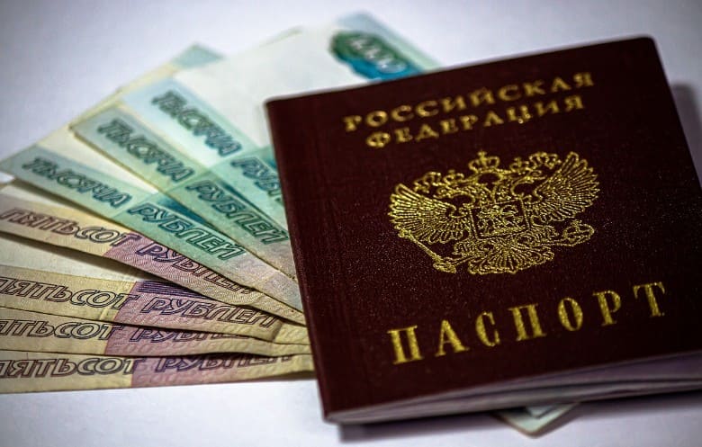 Russian passport, Rubles, Passport on top of the unfolded cash