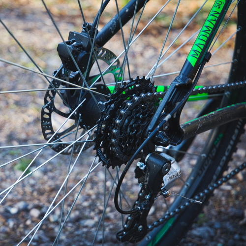 Close-up of bicycle gear shifter and derailleur system for proper cadence control